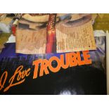 Two film banner posters including "I love trouble" 10ft x 4ft and "Amistad" (2)