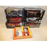 Six 1:18 scale die-cast vehicles including two Mini champs F1 vehicles,