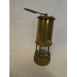 A brass Miner's lamp with swing handle