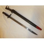 A United States First War Remington bayonet dated 1917 in leather scabbard