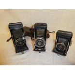 A Kodak 620B folding camera and two Zeiss Ikon folding camera (3)