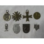 A selection of original Second War German insignia including Cross of Honour with swords,