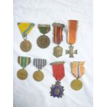 A selection of various Foreign medals including French First War prisoners medal,