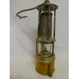 A brass Miner's lamp with exposed gauze body by Wilhelm Seippel of Dortmund