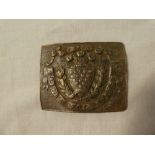 A 19th Century white metal waist belt clasp of the Cornwall Rifle Volunteers in excavated condition