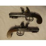 A pair of late 18th/early 19th Century flintlock pocket pistols by Prowett of London with 2½" inch