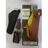 A boxed Lawrence Western pistol holster,