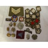 A selection of various Military badges including two School badges,