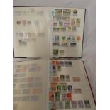 Two stock books containing a collection of Italy stamps,