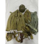 A US Army uniform comprising olive green jacket together with shirts; 1942 dated belt with straps,