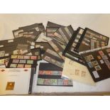 Various stock cards containing a selection of British Commonwealth stamps including Tuvalu gold