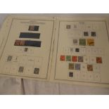 A selection of album leaves containing a collection of Antigua stamps including KGV1 to 5/,