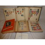 Four albums of mixed World stamps together with stamps in packets, catalogue,