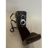 A Japanese Yashica-B twin lens reflex camera in leather carrying case