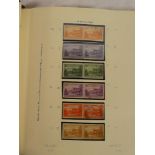 A folder album containing a collection of Norfolk Islands mint stamps 1947 onwards