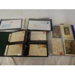 Three albums of postcards and covers with Cornish post marks, Isle of Man, Anglesey,