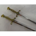 Pair of ornamental swords with cast brass handles