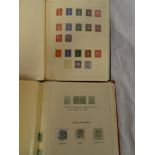 Two folder albums containing a selection of GB stamps including postal history and markings with
