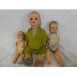 Two baby dolls by Armand Marseille with composition jointed bodies and one other German composition