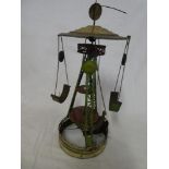 An old tin plate clockwork merry-go-round 17" inches high (af)