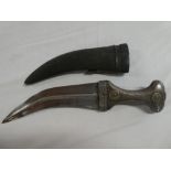 A middle Eastern Jambiya dagger with 7 ½" inch curved double edged blade,