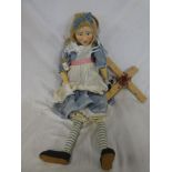 A large wooden jointed puppet of Alice from Alice in Wonderland 32" long