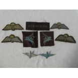 A selection of original Second War Parachute Regiment insignia including printed cloth "Airborne"