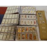 Three albums containing sets and part sets of cigarette cards including Players Aviary & Caged