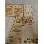 Four albums of mixed World stamps