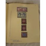 A folder album containing a collection of United Nations mint stamps, 1951 onwards, including pairs,