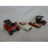 A battery operated vintage-style car and three other various metal cars (4)