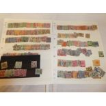 Various stock cards containing a selection of Straits Settlements stamps,