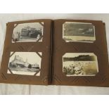 An album containing approximately 150 various black & white and coloured postcards,