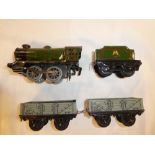 Hornby O gauge - clockwork tin plate engine and tender and two open coal trucks