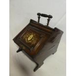 A late Victorian inlaid rosewood coal box with decorated sliding front,