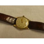 A gentleman's 9ct gold wristwatch by Cyma with leather strap