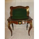 A 19th Century French boulle brass and tortoiseshell inlaid serpentine fronted turn-over top card