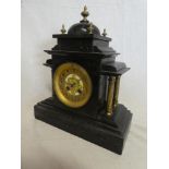 A Victorian mantel clock with gilt circular dial by Blurton of Stourbridge in black slate and brass