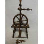 A small 19th Century spinning wheel with turned supports,