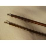 A gentleman's walking cane with Continental silver top and one other gent's walking cane (2)