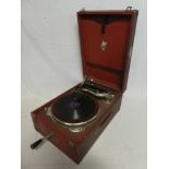An old table top portable gramophone by Apollo in red fibre case