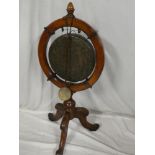 A late Victorian/Edwardian carved oak gong stand of circular form with turned column and carved