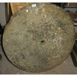An old stone circular mill wheel,
