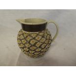 An early 19th Century pottery gravelware tapered jug with geometric decoration 4½" high