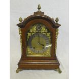 A good quality striking bracket clock by W & H with gilt and silvered arched dial in polished oak