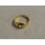 An 18ct gold gypsy-style dress ring set a diamond