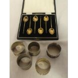 A set of six silver and enamelled coffee spoons with bean terminals,