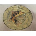 A Cornish studio pottery circular charger with fish decoration by A Brough,