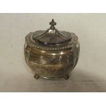 A late Victorian silver shaped-rectangular tea caddy with hinged lid,