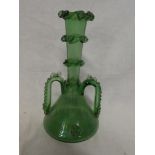A 19th Century green tinted glass two handled spill vase with raised decoration and circular